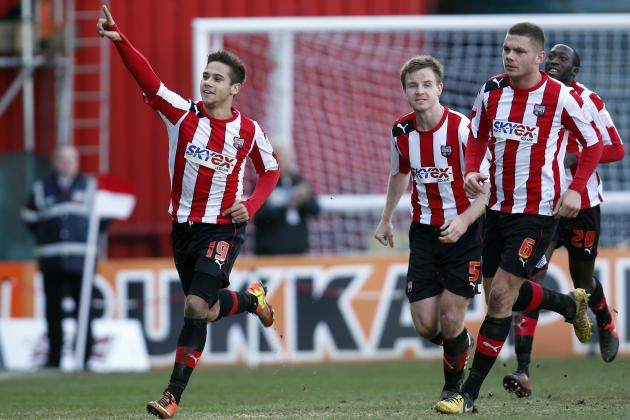 Brentford's Harry Forrester, left, celebrates after scoring against Chelsea during their English FA Cup fourth round soccer match in London, Sunday, Jan. 27, 2013. The match ended in a 2-2 draw. (AP Photo/Lefteris Pitarakis)
