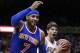 New York Knicks' Carmelo Anthony, left, calls for a foul as Atlanta Hawks' Kyle Korver, right, reacts to the referee's call in favor of Anthony during the fourth quarter of an NBA basketball game Saturday, Dec. 26, 2015, in Atlanta. (AP Photo/David Goldman)