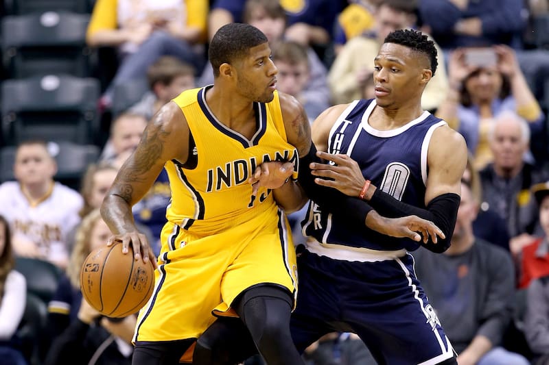 INDIANAPOLIS, IN - MARCH 19: Paul George #13 of the Indiana Pacers dribbles the ball while defended by Russell Westbrook #0 of the Oklahoma City Thunder at Bankers Life Fieldhouse on March 19, 2016 in Indianapolis, Indiana. NOTE TO USER: User expressly acknowledges and agrees that, by downloading and or using this photograph, User is consenting to the terms and conditions of the Getty Images License Agreement. (Photo by Andy Lyons/Getty Images)
