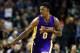 Los Angeles Lakers guard Nick Young celebrates after a three point basket against the Boston Celtics during the second quarter of an NBA basketball game in Boston Friday, Feb. 3, 2017. (AP Photo/Winslow Townson)