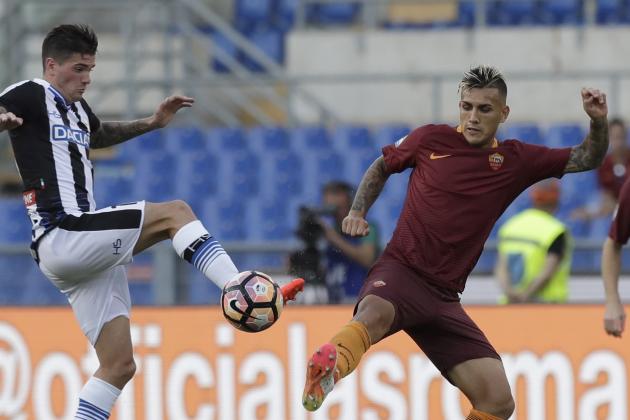 Udinese's Rodrigo De Paul, left, and Roma’s Leandro Paredes go for the ball during a Serie A soccer match between Roma and Udinese, at Rome's Olympic stadium, Saturday, Aug. 20, 2016. (AP Photo/Alessandra Tarantino)
