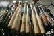 ** ADVANCE FOR WEEKEND, JUNE 30 - JULY 1 ** A display of wooden, left, and aluminum, right, baseball bats hangs in a sporting goods store in Robinson Township, Pa., Tuesday, June 26, 2007. A small but vocal contingent of lawmakers, coaches, and parents are trying to ban the use of metal bats in youth baseball games. (AP Photo/Gene J. Puskar)
