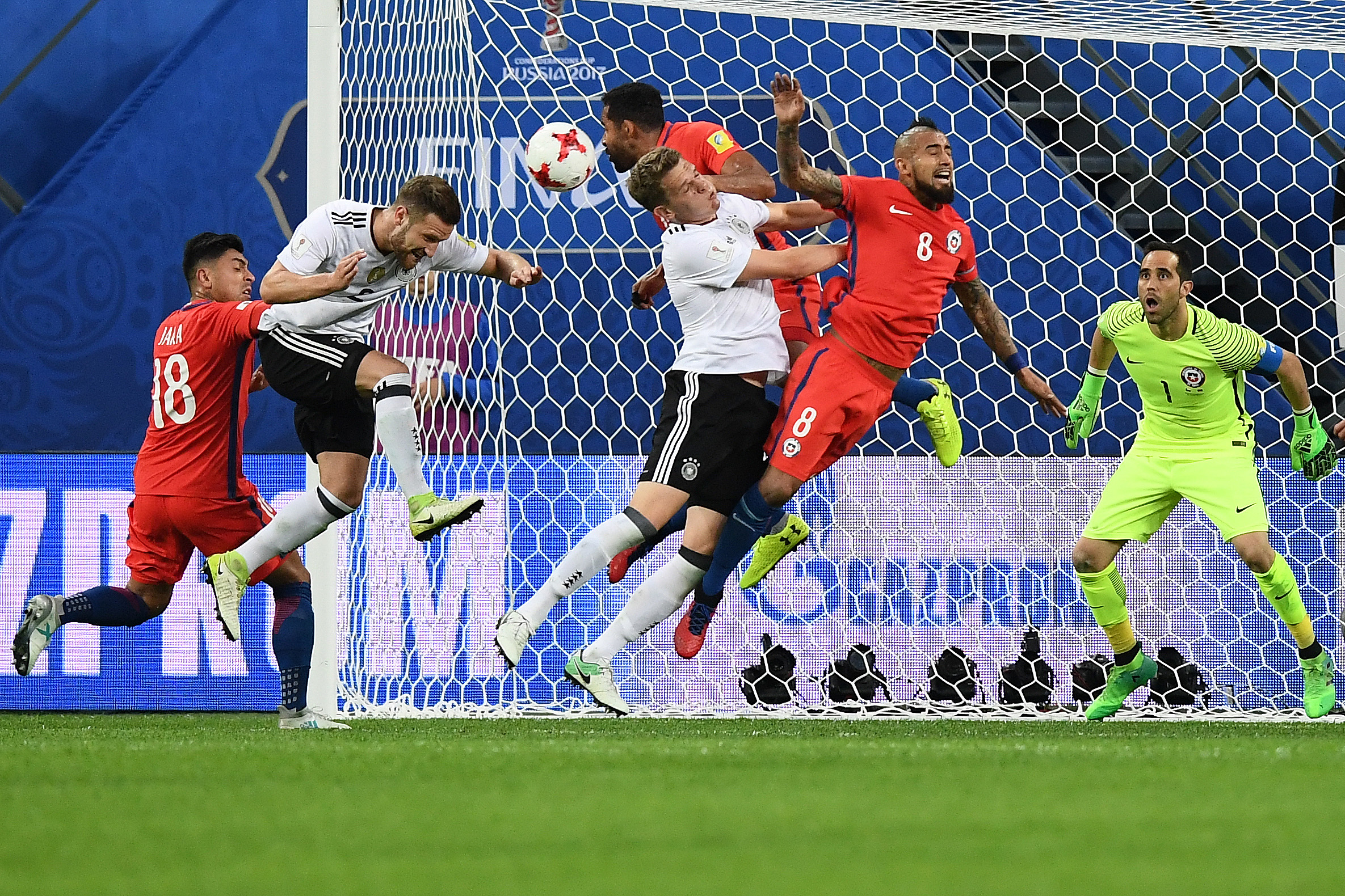 Germany's defender Jonas Hector (L) and Germany's defender Matthias Ginter vie with Chile's midfielder Arturo Vidal (C) during the 2017 Confederations Cup final football match between Chile and Germany at the Saint Petersburg Stadium in Saint Petersburg on July 2, 2017. / AFP PHOTO / FRANCK FIFE (Photo credit should read FRANCK FIFE/AFP/Getty Images)