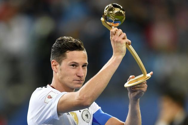 Germany's Julian Draxler holds the Golden Ball best player award after Germany won 1-0 in the Confederations Cup final soccer match between Chile and Germany, at the St.Petersburg Stadium, Russia, Sunday July 2, 2017. (AP Photo/Martin Meissner)