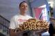 Current men's champion Joey Chestnut, of San Jose, CA., holds a tray of hot dogs during the weigh-in for the 2017 Nathan's Hot Dog Eating Contest, in Brooklyn Borough Hall, in New York, Monday, July 3, 2017. Chestnut weighed-in at 221.5 pounds. (AP Photo/Richard Drew)