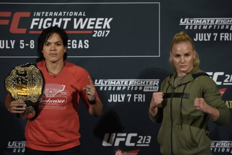 LOS ANGELES, CA - JUNE 29: Amanda Nunes (L), UFC bantamweight champion, poses with her belt as she faces face off with challenger Valentina Shevchenko during the UFC International Fight Week Media Day June 29, 2017, in Los Angeles, California. (Photo by Kevork Djansezian/Zuffa LLC via Getty Images)