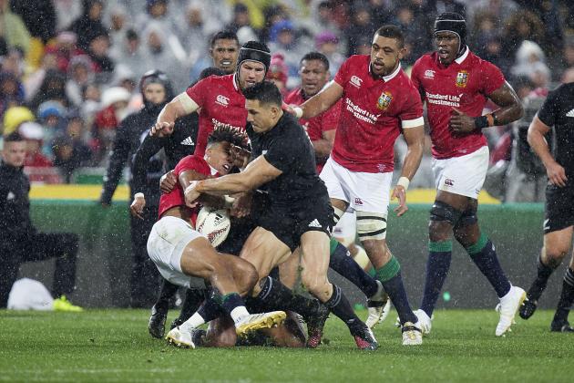 New Zealand inside center Sonny Bill Williams, right, tackles Lions winger Anthony Watson during the second rugby test between the British and Irish Lions and the All Blacks in Wellington, New Zealand, Saturday, July 1, 2017. (Mark Mitchell/New Zealand Herald via AP)