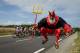 German supporter Didi Senft known as El Diablo jumps as the pack ride during the 213,5 km seventh stage of the 104th edition of the Tour de France cycling race on July 7, 2017 between Troyes and Nuits-Saint-Georges. / AFP PHOTO / PHILIPPE LOPEZ (Photo credit should read PHILIPPE LOPEZ/AFP/Getty Images)