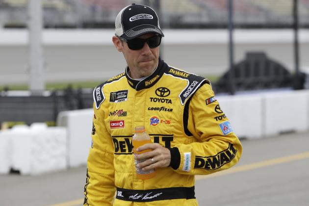 Matt Kenseth walks in the pit area before qualifying, Friday, June 16, 2017, for the NASCAR Sprint Cup series auto race in Brooklyn, Mich. (AP Photo/Carlos Osorio)