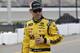 Matt Kenseth walks in the pit area before qualifying, Friday, June 16, 2017, for the NASCAR Sprint Cup series auto race in Brooklyn, Mich. (AP Photo/Carlos Osorio)