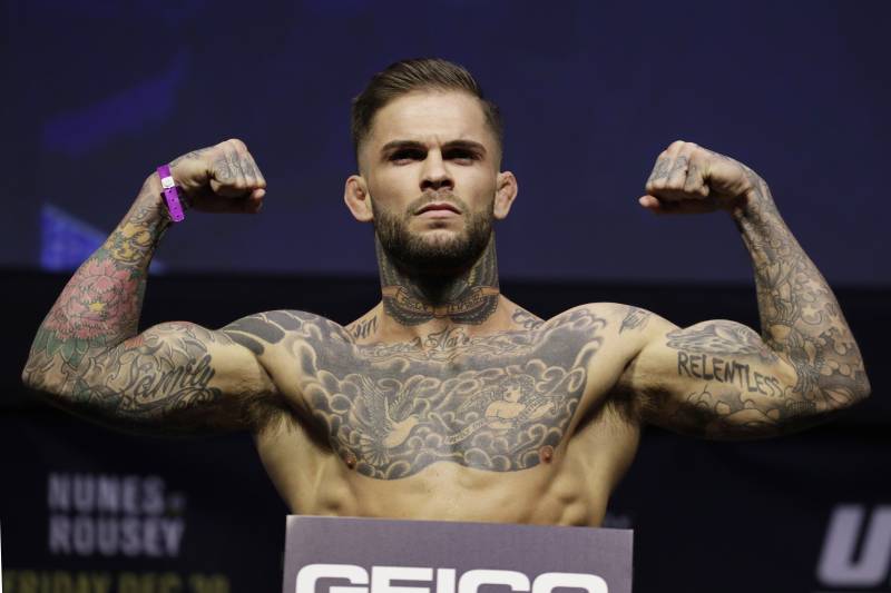 Cody Garbrandt poses for photographers during an event for UFC 207, Thursday, Dec. 29, 2016, in Las Vegas. Garbrandt is scheduled to fight Dominick Cruz in a mixed martial arts bantamweight championship bout Saturday in Las Vegas. (AP Photo/John Locher)