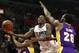 Los Angeles Clippers guard Jamal Crawford, center, goes to the basket in between Los Angeles Lakers guard David Nwaba, left, and center Tarik Black, right, during the first half of an NBA basketball game, Saturday, April 1, 2017, in Los Angeles. (AP Photo/Ryan Kang)