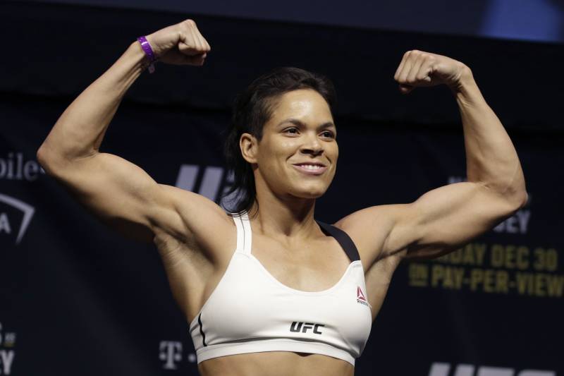 Amanda Nunes poses for photographers during an event for UFC 207, Thursday, Dec. 29, 2016, in Las Vegas. Nunes is scheduled to fight Ronda Rousey in a mixed martial arts women's bantamweight championship bout Saturday in Las Vegas. (AP Photo/John Locher)