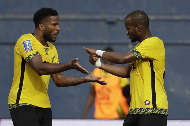 Jamaica's Romario Williams, right, greeted by Jermaine Taylor, left, after Williams scored a goal against Curacao during a CONCACAF Gold Cup soccer match in San Diego, Sunday, July 9, 2017. (AP Photo/Gregory Bull)