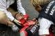 TOPSHOT - Australia's Richie Porte receives medical assistance after falling during the 181,5 km ninth stage of the 104th edition of the Tour de France cycling race on July 9, 2017 between Nantua and Chambery. / AFP PHOTO / PHILIPPE LOPEZ (Photo credit should read PHILIPPE LOPEZ/AFP/Getty Images)