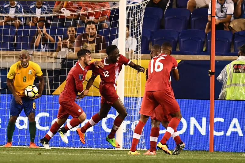 Canada's midfielder Alphonso Davies (C) celebrates after scoring a goal against French Guiana during their 2017 Concacaf Gold Cup Group A match at the Red Bull Arena in Harrison, New Jersey, on July 7, 2017.  / AFP PHOTO / Jewel SAMAD        (Photo credit should read JEWEL SAMAD/AFP/Getty Images)