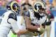 Los Angeles Rams running back Todd Gurly (30) takes a handoff from quarterback Jared Goff (16) in the third quarter of a game against the Atlanta Falcons played at the Los Angeles Memorial Coliseum in Los Angeles on Sunday, December 11, 2016. (AP Photo/John Cordes)