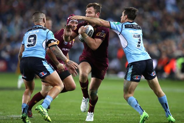 SYDNEY, AUSTRALIA - JUNE 21:  Gavin Cooper of the Maroons is tackled by Mitchell Pearce of the Blues during game two of the State Of Origin series between the New South Wales Blues and the Queensland Maroons at ANZ Stadium on June 21, 2017 in Sydney, Australia.  (Photo by Ryan Pierse/Getty Images)