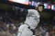 American League's Seattle Mariners Robinson Cano (22), rounds the bases after hitting a homerun in the tenth inning, during the MLB baseball All-Star Game, Tuesday, July 11, 2017, in Miami. (AP Photo/Lynne Sladky)
