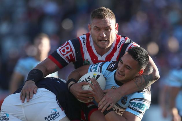 GOSFORD, AUSTRALIA - JULY 01:  Valentine Holmes of the Sharks is tackled by Jared Waerea-Hargreaves of the Roosters during the round 17 NRL match between the Sydney Roosters and the Cronulla Sharks at Central Coast Stadium on July 1, 2017 in Gosford, Australia.  (Photo by Tony Feder/Getty Images)