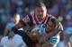 GOSFORD, AUSTRALIA - JULY 01: Valentine Holmes of the Sharks is tackled by Jared Waerea-Hargreaves of the Roosters during the round 17 NRL match between the Sydney Roosters and the Cronulla Sharks at Central Coast Stadium on July 1, 2017 in Gosford, Australia. (Photo by Tony Feder/Getty Images)