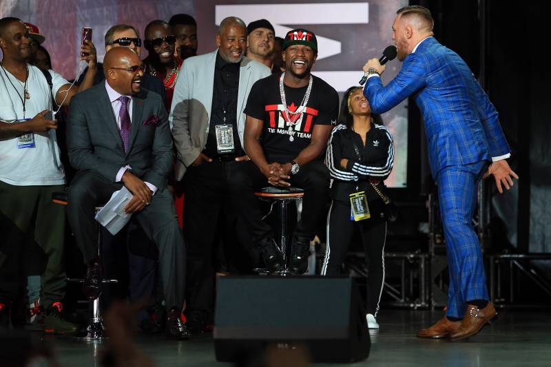 TORONTO, ON - JULY 12: Conor McGregor speaks to Floyd Mayweather Jr. during the Floyd Mayweather Jr. v Conor McGregor World Press Tour at Budweiser Stage on July 12, 2017 in Toronto, Canada. (Photo by Vaughn Ridley/Getty Images)