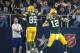 Green Bay Packers quarterback Aaron Rodgers (12) and Jared Cook (89) celebrate after a touchdown during the first half of an NFL divisional playoff football game against the Dallas Cowboys Sunday, Jan. 15, 2017, in Arlington, Texas. (AP Photo/Tony Gutierrez)