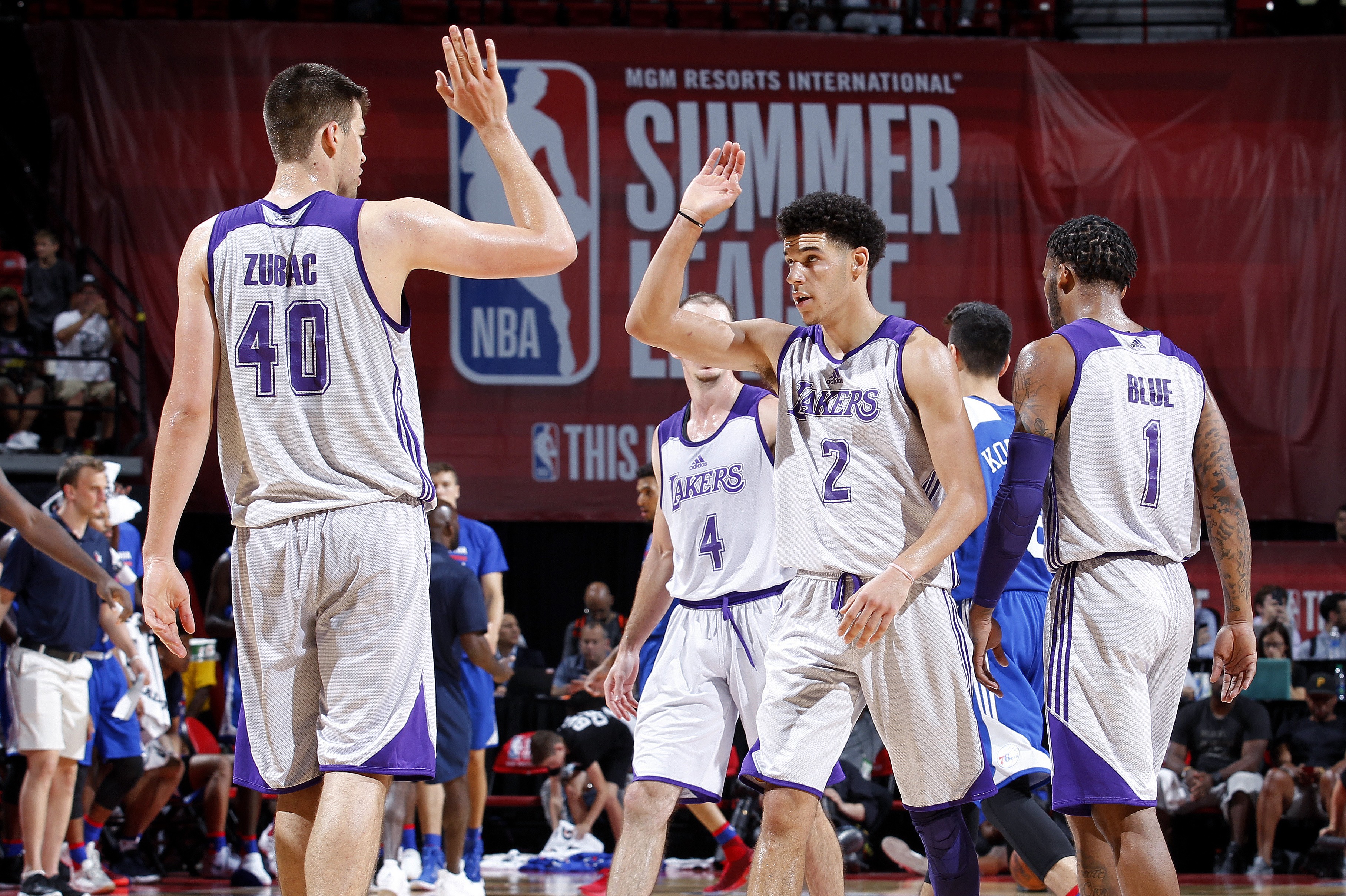 LAS VEGAS, NV - JULY 12: Ivica Zubac #40 and Lonzo Ball #2 of the Los Angeles Lakers high five each other during the game against the Philadelphia 76ers during the 2017 Las Vegas Summer League on July 12, 2017 at the Thomas Mack Center in Las Vegas, Nevada. NOTE TO USER: User expressly acknowledges and agrees that, by downloading and or using this Photograph, user is consenting to the terms and conditions of the Getty Images License Agreement. Mandatory Copyright Notice: Copyright 2017 NBAE (Photo by Jack Arent/NBAE via Getty Images)