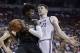 Phoenix Suns' Josh Jackson grabs a rebound next to Sacramento Kings' Jack Cooley during the first half of an NBA summer league basketball game, Friday, July 7, 2017, in Las Vegas. (AP Photo/John Locher)