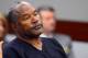 LAS VEGAS, NV - MAY 17: O.J. Simpson watches his former defense attorney Yale Galanter testify during an evidentiary hearing in Clark County District Court on May 17, 2013 in Las Vegas, Nevada. Simpson, who is currently serving a nine-to-33-year sentence in state prison as a result of his October 2008 conviction for armed robbery and kidnapping charges, is using a writ of habeas corpus to seek a new trial, claiming he had such bad representation that his conviction should be reversed. (Photo by Ethan Miller/Getty Images)