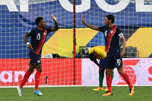 Rodney Wallace (L) and Bryan ruiz of Costa Rica celebrate after the seconde goal against French Guiana during their CONCACAF Gold Cup match on July 14, 2017 in Frisco, Texas.  / AFP PHOTO / Nicholas Kamm        (Photo credit should read NICHOLAS KAMM/AFP/Getty Images)