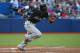 TORONTO, CANADA - JUNE 9: Dee Gordon #9 of the Miami Marlins breakes out of the batterâs box as he grounds out in the fifth inning during MLB game action against the Toronto Blue Jays on June 9, 2015 at Rogers Centre in Toronto, Ontario, Canada. (Photo by Tom Szczerbowski/Getty Images)