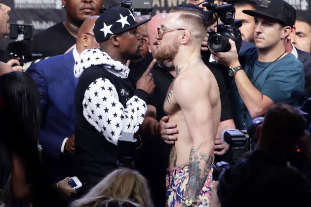 Floyd Mayweather Jr., left, and Conor McGregor exchange words during a news conference at Barclays Center on Thursday, July 13, 2017, in New York. (AP Photo/Frank Franklin II)