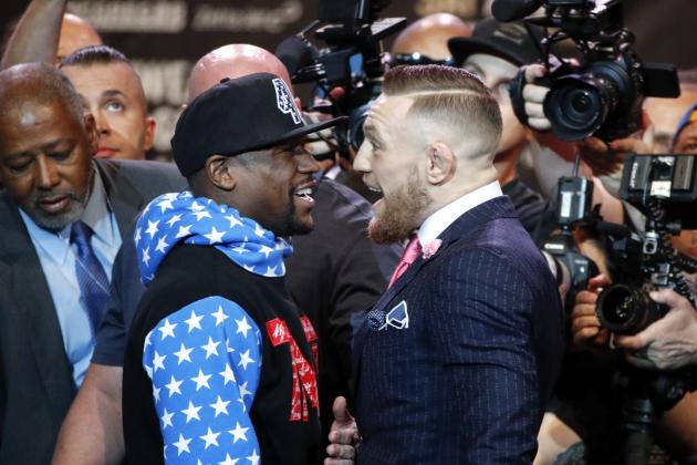 Floyd Mayweather Jr., left, and Conor McGregor exchange words during a news conference at Staples Center Tuesday, July 11, 2017, in Los Angeles. The two will fight in a boxing match in Las Vegas on Aug. 26. (AP Photo/Jae C. Hong)
