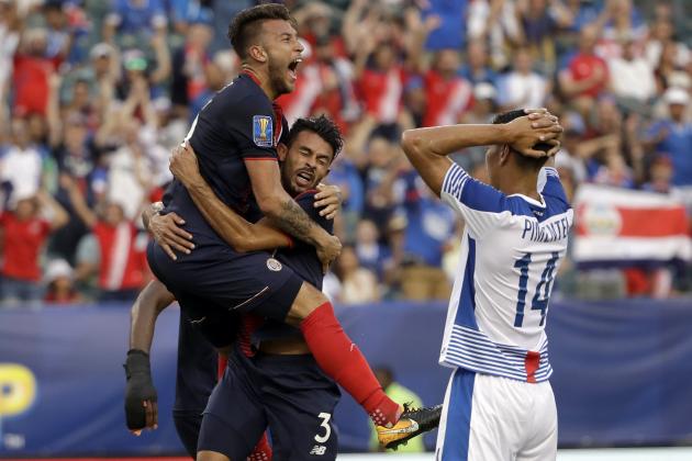 Costa Rica players celebrate an own goal in front of Panama's Valentin Pimentel (14) during a CONCACAF Gold Cup quarterfinal soccer match in Philadelphia, Wednesday, July 19, 2017. (AP Photo/Matt Rourke)
