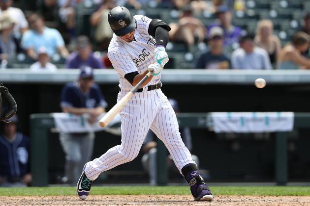 DENVER, CO - JULY 19:  Nolan Arenado #28 of the Colorado Rockies hits a home run in the fourth inning against the San Diego Padres at Coors Field on July 19, 2017 in Denver, Colorado.  (Photo by Matthew Stockman/Getty Images)
