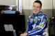 Alex Bowman smiles to team members in his garage during a practice session for the Clash NASCAR auto race at Daytona International Speedway, Friday, Feb. 17, 2017, in Daytona Beach, Fla. (AP Photo/Terry Renna)