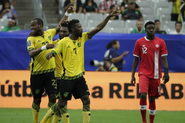 Jamaica's Romario Williams, left, is congratulated by his teammates after he scored his team's second goal against Canada during a CONCACAF Gold Cup quarterfinal soccer match, Thursday, July 20, 2017, in Glendale, Ariz. (AP Photo/Matt York)