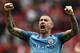 Manchester City's Serbian defender Aleksandar Kolarov celebrates on the pitch after the English Premier League football match between Manchester United and Manchester City at Old Trafford in Manchester, north west England, on September 10, 2016.
Pep Guardiola savoured a derby success over arch-rival Jose Mourinho on Saturday as Manchester City beat Manchester United 2-1 in an engrossing Premier League clash.
/ AFP / Oli SCARFF / RESTRICTED TO EDITORIAL USE. No use with unauthorized audio, video, data, fixture lists, club/league logos or 'live' services. Online in-match use limited to 75 images, no video emulation. No use in betting, games or single club/league/player publications. / (Photo credit should read OLI SCARFF/AFP/Getty Images)