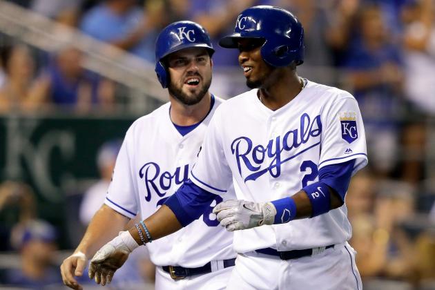 KANSAS CITY, MO - JULY 20:  Mike Moustakas #8 and Alcides Escobar #2 of the Kansas City Royals react after scoring during the 8th inning of the game against the Detroit Tigers at Kauffman Stadium on July 20, 2017 in Kansas City, Missouri.  (Photo by Jamie Squire/Getty Images)