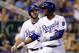 KANSAS CITY, MO - JULY 20: Mike Moustakas #8 and Alcides Escobar #2 of the Kansas City Royals react after scoring during the 8th inning of the game against the Detroit Tigers at Kauffman Stadium on July 20, 2017 in Kansas City, Missouri. (Photo by Jamie Squire/Getty Images)