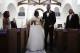 Two-time Olympic jumper Jamie Nieto, right, who was paralyzed from neck down 15 months ago after a spinal cord injury, walks down the aisle with his bride Shevon Stoddart after their wedding ceremony Saturday, July 22, 2017, in El Cajon, Calif. Step by halting step, Nieto made good on his vow to walk his new wife down the aisle of the church and out the door to a waiting limousine. It was roughly 130 steps, with a stop about halfway down the aisle for a kiss to appease the photographers. No cane, no walker, just his right arm holding onto his wife's left arm. (AP Photo/Jae C. Hong)