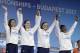 United States' Mallory Comerford, Kelsi Worrell, Katie Ledecky, and Simone Manuel, from left, attend the ceremony after winning the gold medal in the women's 4x100-meter freestyle final during the swimming competitions of the World Aquatics Championships in Budapest, Hungary, Sunday, July 23, 2017.(AP Photo/Michael Sohn)
