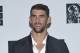 FILe - In this Aug. 28, 2016 file photo, Michael Phelps poses in the press room at the MTV Video Music Awards in New York. Phelps is participating in Discovery network's Shark Week this summer. The week of shark-themed programming in mid-summer is annually Discovery's biggest event. (Photo by Evan Agostini/Invision/AP, File)