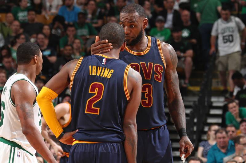 BOSTON, MA - MAY 17:  LeBron James #23 and Kyrie Irving #2 of the Cleveland Cavaliers talk in Game One of the Eastern Conference Finals against the Boston Celtics during the 2017 NBA Playoffs on May 17, 2017 at the TD Garden in Boston, Massachusetts. NOTE TO USER: User expressly acknowledges and agrees that, by downloading and or using this Photograph, user is consenting to the terms and conditions of the Getty Images License Agreement. Mandatory Copyright Notice: Copyright 2017 NBAE (Photo by Nathaniel S. Butler/NBAE via Getty Images)