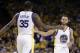 Golden State Warriors' Stephen Curry, right, shakes hands with teammate Kevin Durant (35) during the first half in Game 2 of an NBA basketball second-round playoff series against the Utah Jazz, Thursday, May 4, 2017, in Oakland, Calif. (AP Photo/Marcio Jose Sanchez)