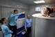France goalkeeper Celine Deville stands in a medical device used for cryotherapy next to defender Julie Soyer, center, at the French national football team training base in Clairefontaine-en-Yvelines in May 2015 during training for the 2015 FIFA World Cup.