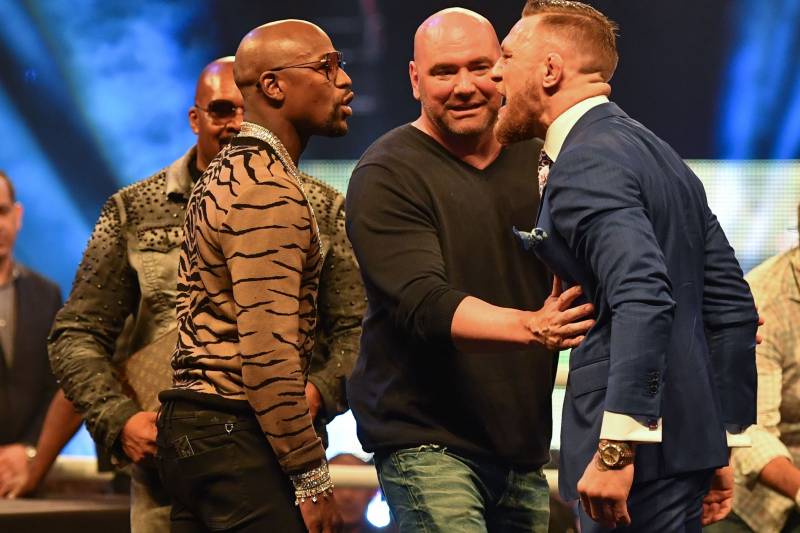 Jul 14, 2017; London, United Kingdom; Dana White steps in as Conor McGregor and Floyd Mayweather face off during a world tour press conference to promote the upcoming Mayweather vs McGregor boxing fight at SSE Arena. Mandatory Credit: Steve Flynn-USA TODAY Sports