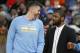 Cleveland Cavaliers guard Kyrie Irving, center, jokes with Denver Nuggets guards Mike Miller, left, and Emmanuel Mudiay as the teams warm up for the second half of an NBA basketball game Tuesday, Dec. 29, 2015, in Denver. Cleveland won 93-87. (AP Photo/David Zalubowski)
