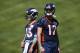 Denver Broncos quarterbacks Paxton Lynch (12) and Trevor Siemian during drills at the team's mandatory minicamp session Thursday, June 15, 2017, at the Broncos' headquarters in Englewood, Colo. (AP Photo/David Zalubowski)